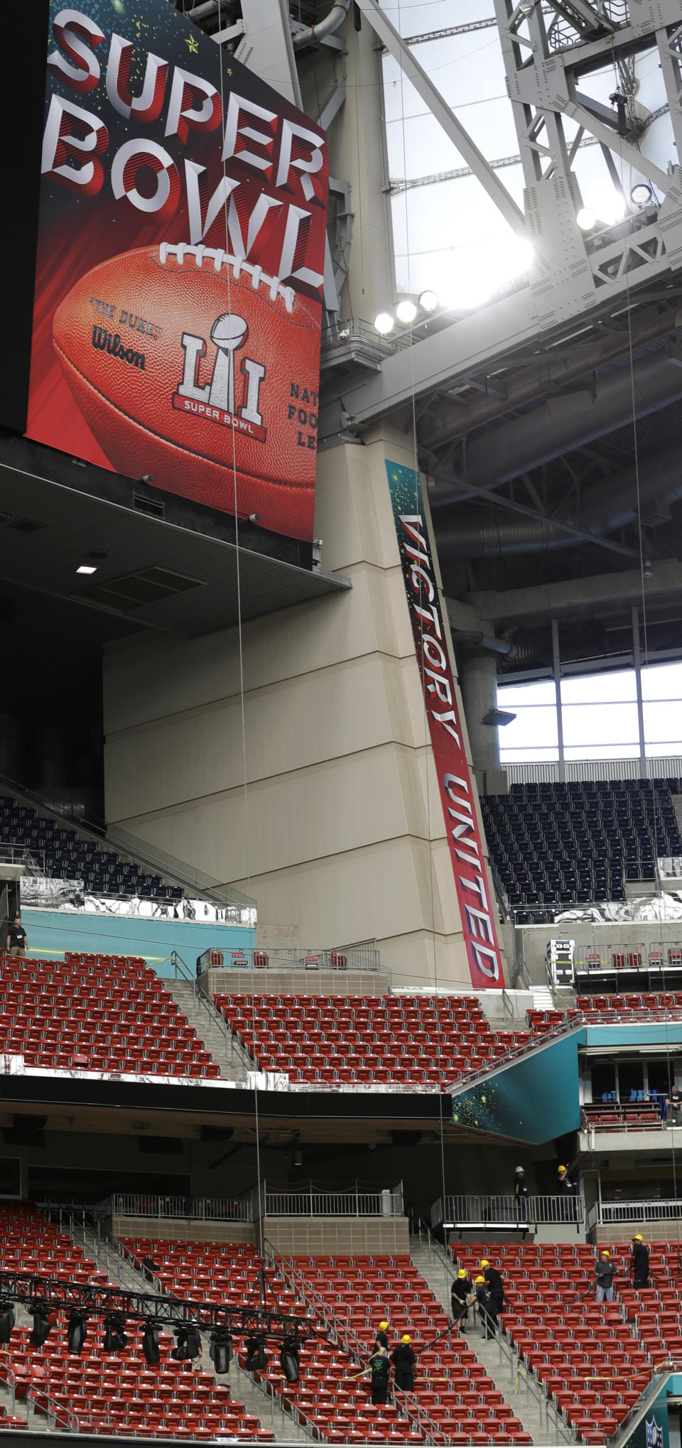 Workers prepare for Super Bowl LI at NRG Stadium Tuesday, Jan. 24, 2017, in Houston. The New England Patriots will play the Atlanta Falcons in NFL football's Super Bowl LI on Sunday, Feb. 5, 2017. (AP Photo/David J. Phillip)