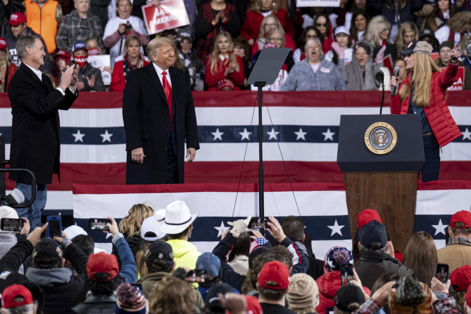 President Trump shares the stage with Sens. Kelly Loeffler and David Perdue, at a rally in Valdosta, Ga., on Dec. 5. (Ben Gray/AP)