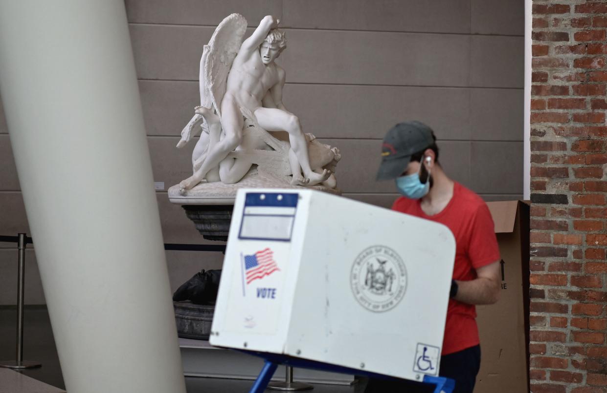 Residents vote during the New York City mayoral primary election at the Brooklyn Museum polling station on June 22, 2021, in New York City.