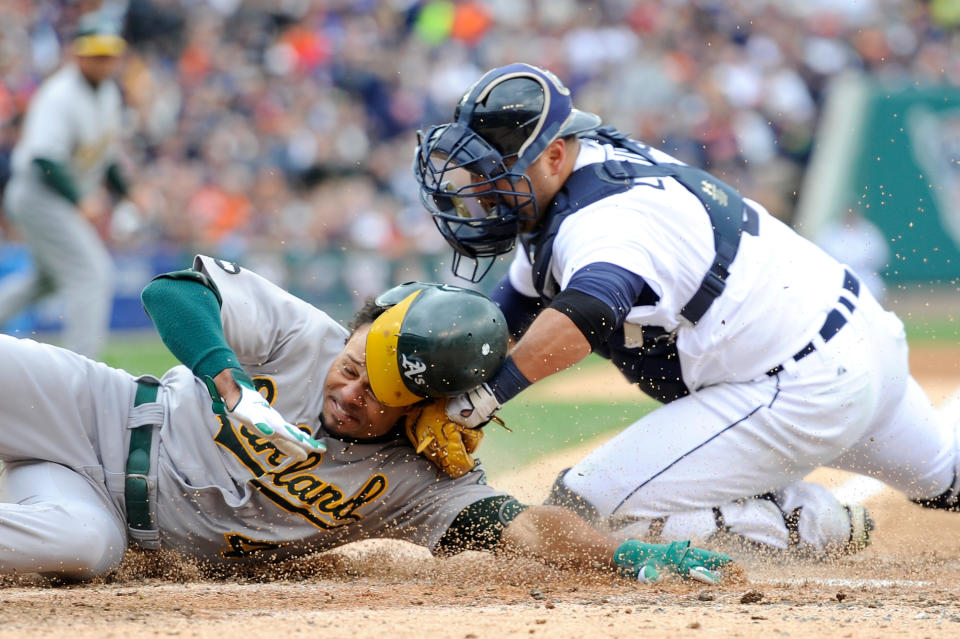 Coco Crisp #4 of the Oakland Athletics is tagged out at home Gerald Laird #9 of the Detroit Tigers in the top of the third inning during Game Two of the American League Division Series at Comerica Park on October 7, 2012 in Detroit, Michigan. (Photo by Jason Miller/Getty Images)