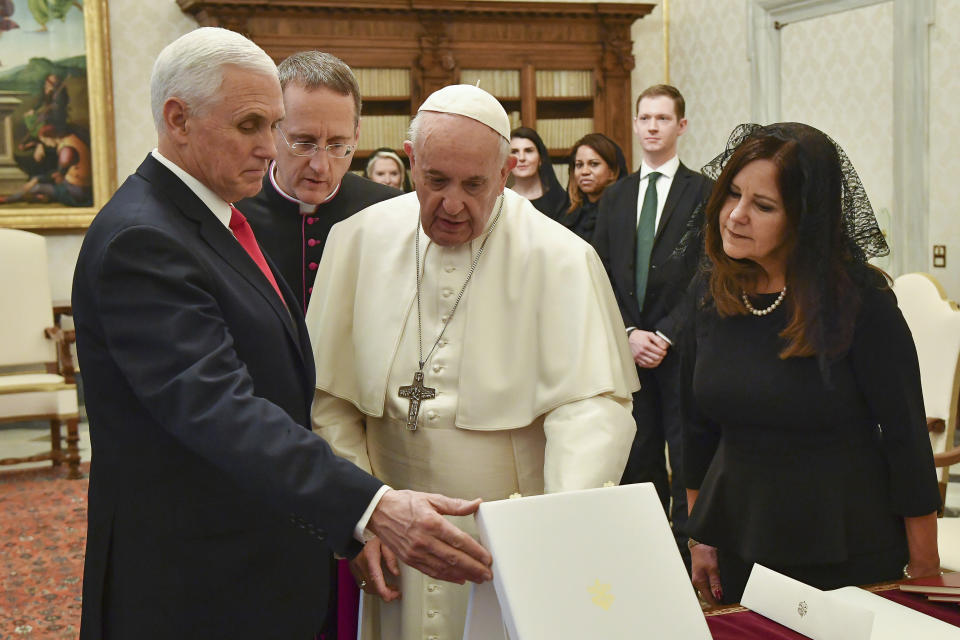 Pope Francis exchanges gifts with US Vice President Mike Pence, left, and his wife Karen on the occasion of their private audience, at the Vatican, Friday, Jan. 24, 2020. Pence told Pope Francis, “You made me a hero" back home by granting him a private audience at the Vatican on Friday. (Alessandro Di Meo/Pool Photo via AP)