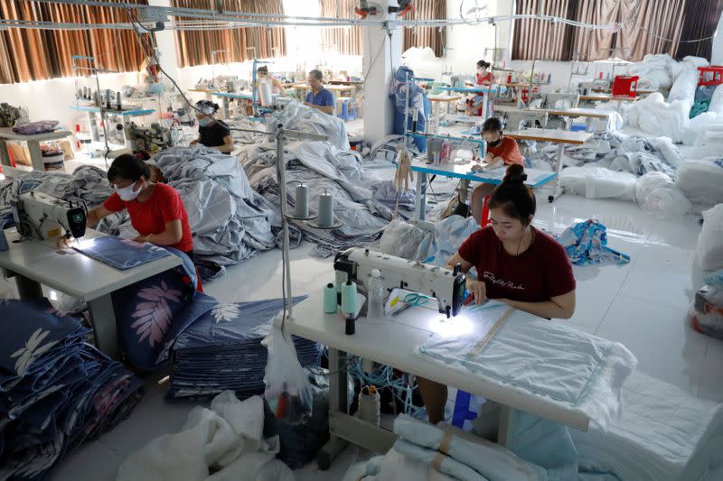 Labourers work at a private factory after government eased nationwide lockdown following the coronavirus disease (COVID-19) in Hanoi