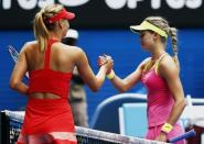 Maria Sharapova (L) of Russia shakes hands with Eugenie Bouchard of Canada during their women's singles quarter-final match at the Australian Open 2015 tennis tournament in Melbourne January 27, 2015. REUTERS/Issei Kato