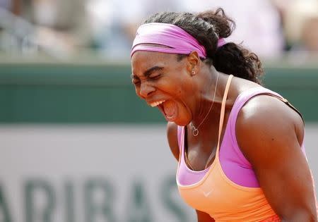 Serena Williams of the U.S. reacts during the women's singles match against Anna-Lena Friedsam of Germany at the French Open tennis tournament at the Roland Garros stadium in Paris, France, May 28, 2015. REUTERS/Jean-Paul Pelissier