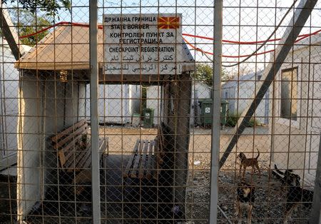 A sign on a border fence shows the Macedonian checkpoint at the Greek-Macedonian border near the village of Idomeni, Greece, August 10, 2016. REUTERS/Alexandros Avramidis