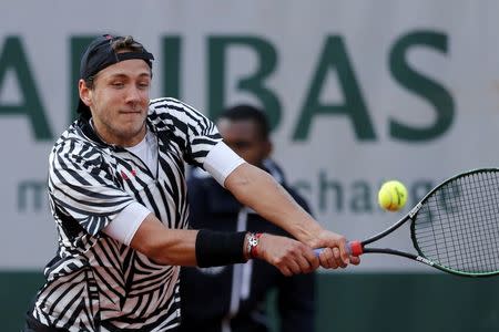 Tennis - French Open - Roland Garros - Julien Benneteau of France vs Lucas Pouille of France - Paris, France - 23/05/16. Lucas Pouille returns the ball. REUTERS/Benoit Tessier