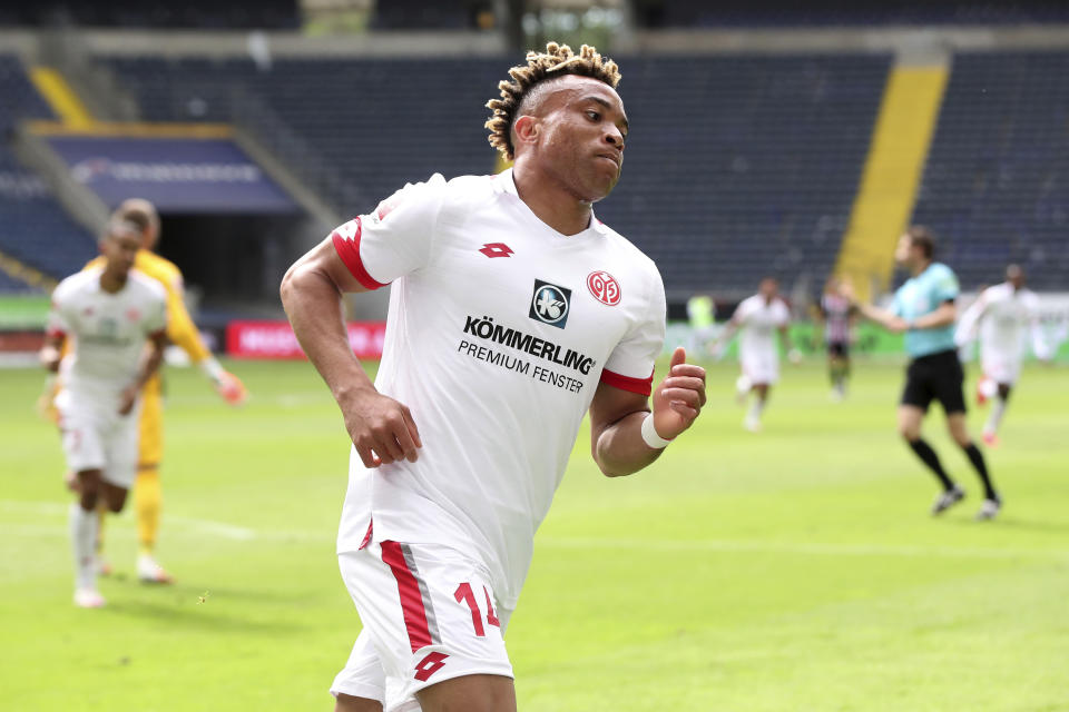 Mainz's Pierre Kunde Malong celebrates scoring his side's 2nd goal during the German Bundesliga soccer match between Eintracht and Mainz, in Frankfurt, Germany, Saturday, June 6, 2020. Because of the coronavirus outbreak all soccer matches of the German Bundesliga take place without spectators. (Alexander Hassenstein/Pool Photo via AP)