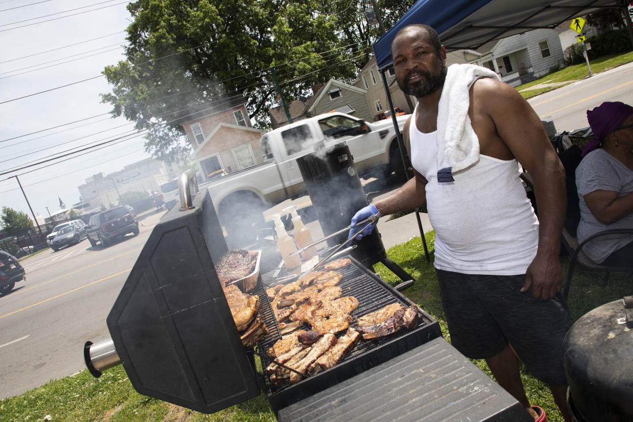 Derek Litzy grills pork chops, burgers and more on his lawn. (Lili Kobielski for NBC News)