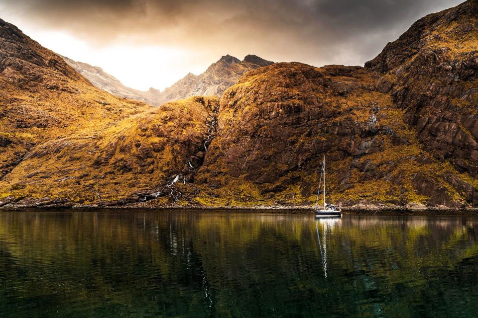 <p>In the shadow of the Black Cuillin Mountains, Loch Coruisk mirrors an evershifting Scottish sky. Although only accessible by boat or on foot, these deep, dark waters have attracted many an artistic luminary over the years, including Lord Tennyson, Sir Walter Scott and JMW Turner (who almost met an untimely end while clinging to a crag to paint the view). Coire Uisg in Gaelic – meaning ‘cauldron of waters’ – the lake is the alleged abode of a shape-shifting kelpie: a folklore figure able to assume both horse and human form.</p><p><a class="link " href="https://www.walkhighlands.co.uk/skye/lochcoruisk.shtml" rel="nofollow noopener" target="_blank" data-ylk="slk:MORE INFO;elm:context_link;itc:0;sec:content-canvas">MORE INFO</a></p>