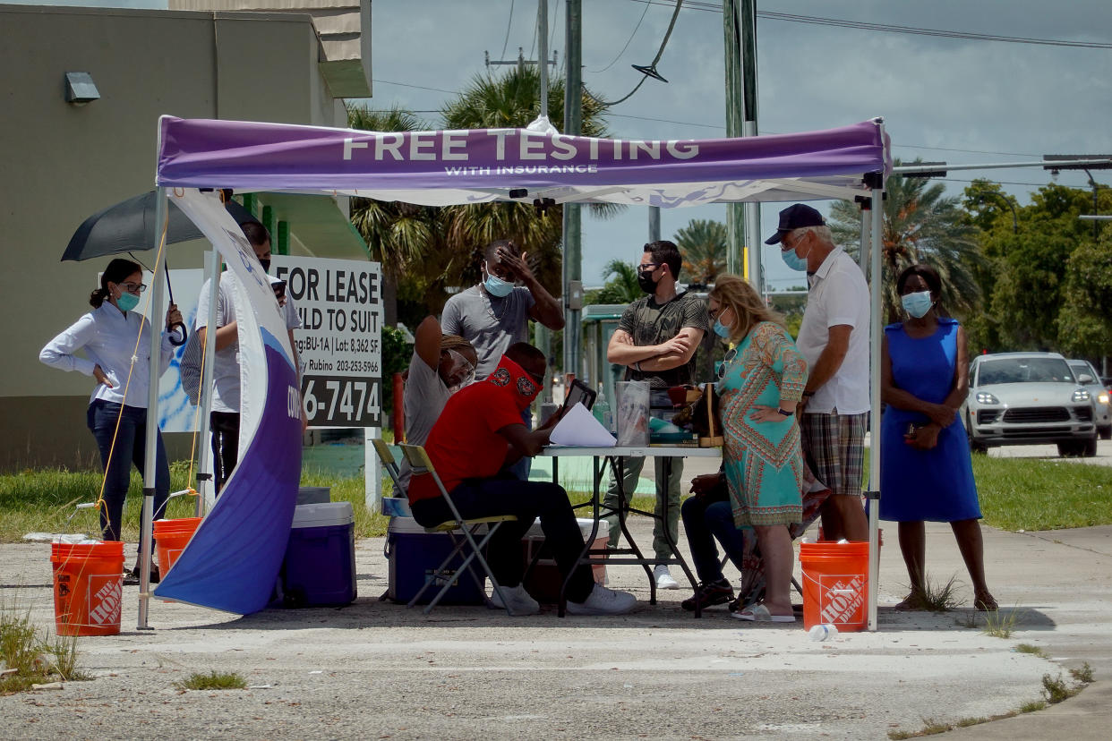 People wait to receive a COVID-19 test at a pop-up testing location on July 26, 2021 in Miami, Florida. (Joe Raedle/Getty Images)