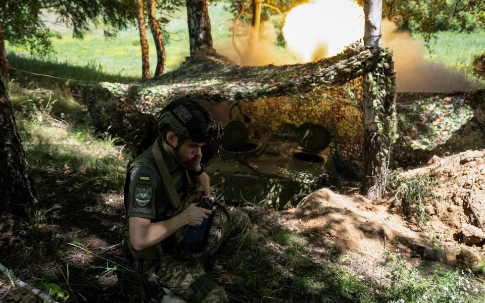 Ukrainian artilleryman of the 92nd Ivan Sirko Separate Assault Brigade fires a 2S1 Gvozdika self-propelled howitzer towards Russian troops in the Kharkiv region