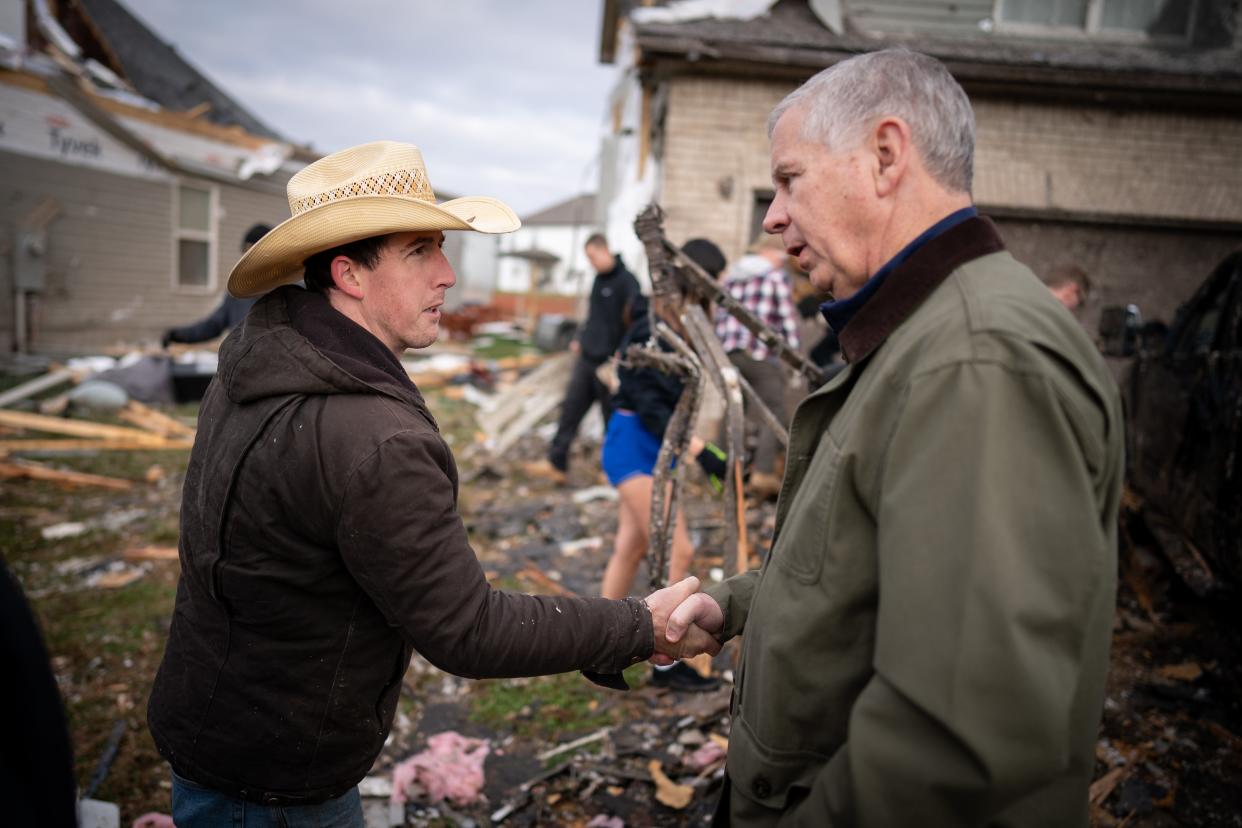 Clarksville City Mayor Joe Pitts, right, greets Joseph Mullen, left, whose home was damaged in Clarksville, Tenn., Sunday, Dec. 10, 2023. Tornadoes struck Middle Tennessee on Saturday, killing at least six people and leaving more than 160,000 Middle Tennessee residents without power.
