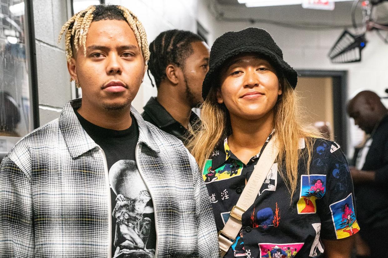 Cordae and Tennis Player Naomi Osaka pose after the WBA World Lightweight Championship title bout between Gervonta Davis and Rolando Romero at the Barclays Center in Brooklyn on May 28, 2022 in New York City.