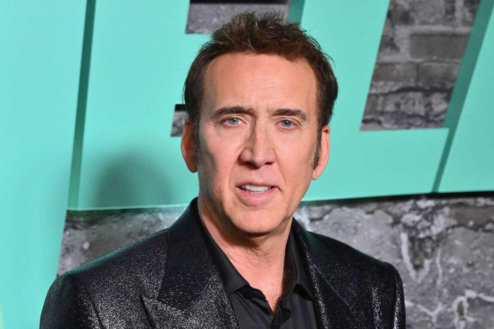 <p>ANGELA WEISS/AFP via Getty</p> Nicolas Cage attends the premiere of 