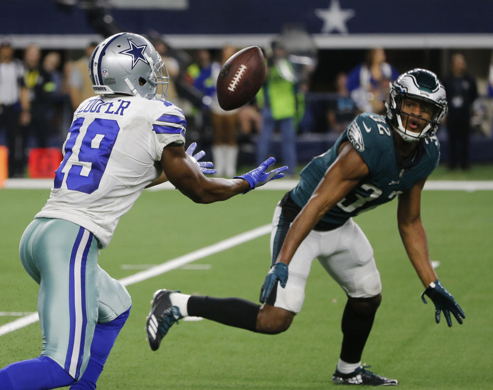 Dallas Cowboys wide receiver Amari Cooper (19) makes a 15-yard catch in front of Philadelphia Eagles cornerback Rasul Douglas (32) for a touchdown in overtime of an NFL football game, in Arlington, Texas, Sunday, Dec. 9, 2018. (AP Photo/Michael Ainsworth)