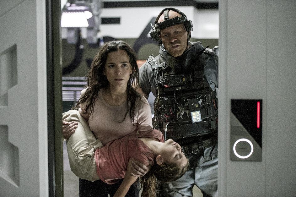 This film publicity image released by Tristar, Columbia Pictures-Sony shows Alice Braga, left, Emma Tremblay and Josh Blacker, right, in a scene from "Elysium." (AP Photo/Tristar, Columbia Pictures - Sony, Kimberley French)