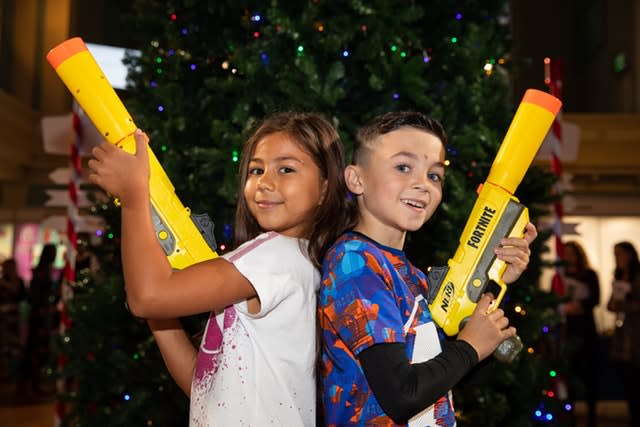 Ayva Eiman, seven ,and Josh Wilcock, eight, play with a Nerf Elite Fortnite SP-L Hasbro toy