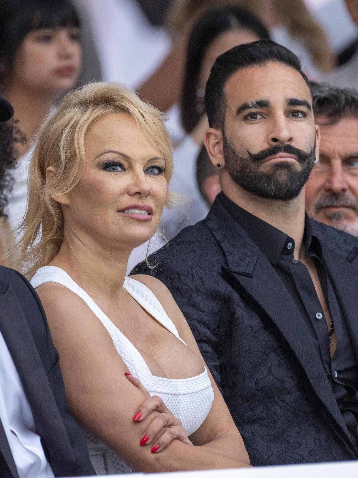 MONTE-CARLO, MONACO - MAY 24: (L-R) Pamela Anderson and Adil Rami attend Amber Lounge 2019 Fashion Show on May 24, 2019 in Monte-Carlo, Monaco. (Photo by Arnold Jerocki/Getty Images) 