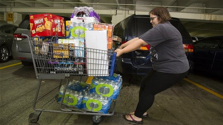 shopper pulls cart through garage