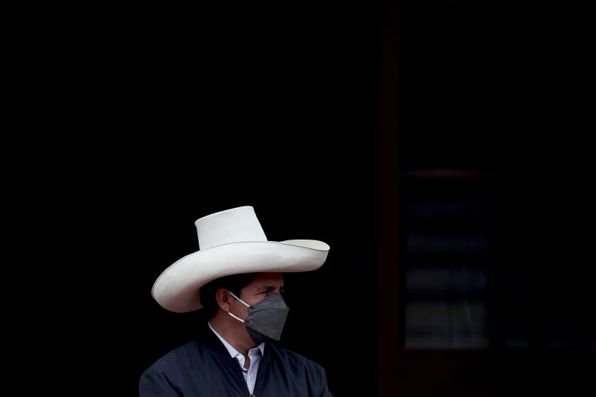 FILE - Peruvian President Pedro Castillo attends a ceremony to promote a law that extends automatic graduation from university due to the COVID-19 pandemic in Lima, Peru, Nov. 22, 2021. After a year in office, Castillo has seen his poll number fall as his administration has been beset by a myriad of troubles, ranging from accusations of corruption to having parliament attempt to remove him twice from office. (AP Photo/Guadalupe Pardo, File)