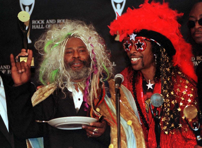 George Clinton (L) and Bootsy Collins (R), members of the funk group “Parliament-Funkadelic” answer questions during a press conference after ceremonies where they were inducted into the Rock and Roll Hall of Fame at a Cleveland, OH hotel 06 May. Ten people or groups were inducted into the Hall of Fame. 