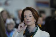 Prime Minister Julia Gillard waits for London 2012 Olympic athletes to arrive at Sydney Airport Wednesday August 15, 2012 . (AAP Image/Mick Tsikas) NO ARCHIVING
