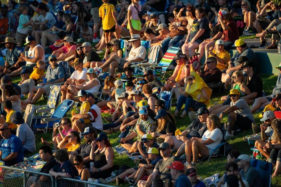 Savanna Bananas’ fans watch the game in the setting sun during the Savannah Bananas World Tour on Saturday, July 29, 2023, at Sutter Health Park in West Sacramento.