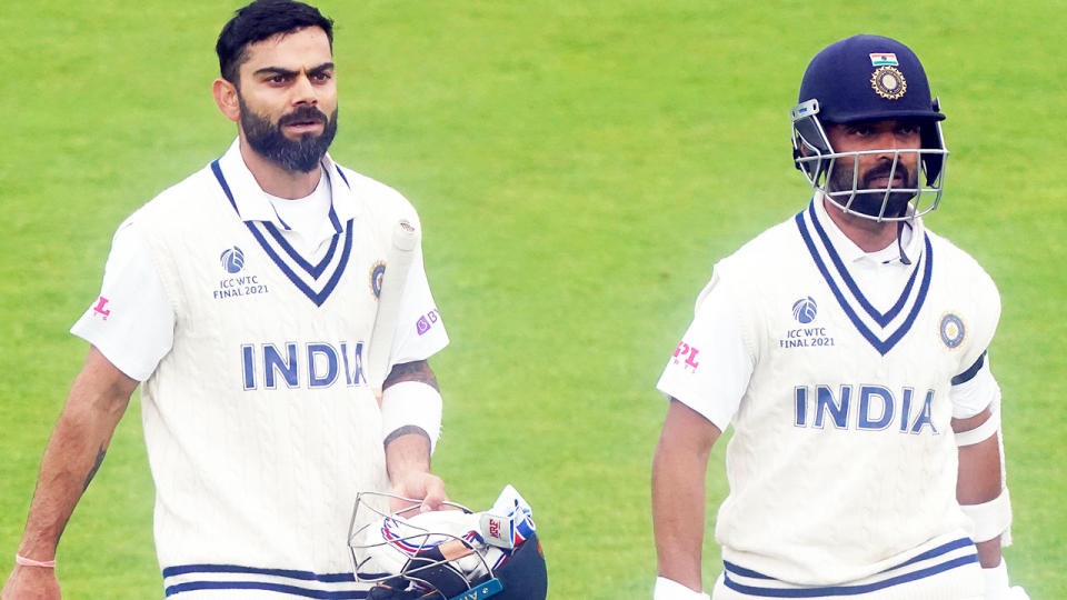 Virat Kohli and Ajinkya Rahane, pictured here walking off the field after bad light stopped play.