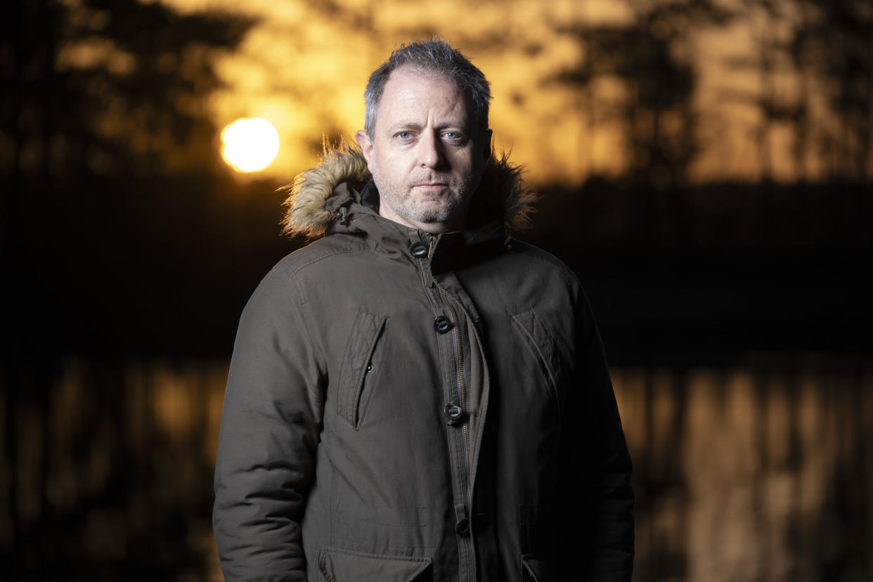  Flash photography portrait taken with the Sony A9 III at first light with golden hour background reflected in a lake. 