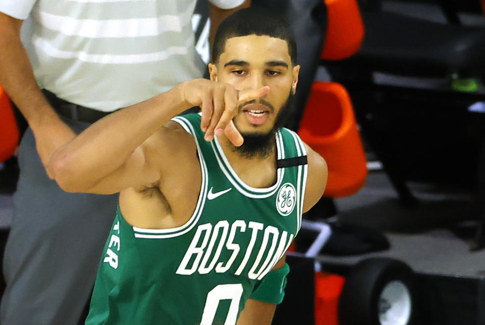 <a class="link " href="https://sports.yahoo.com/nba/players/5765" data-i13n="sec:content-canvas;subsec:anchor_text;elm:context_link" data-ylk="slk:Jayson Tatum;sec:content-canvas;subsec:anchor_text;elm:context_link;itc:0">Jayson Tatum</a> #0 of the Boston Celtics celebrates a 3-point shot against the Philadelphia 76ers during the third quarter in Game Two of the Eastern Conference First Round during the 2020 NBA Playoffs at The Field House at ESPN Wide World Of Sports Complex on August 19, 2020, in Lake Buena Vista, Florida. Kevin C. Cox/Getty Images