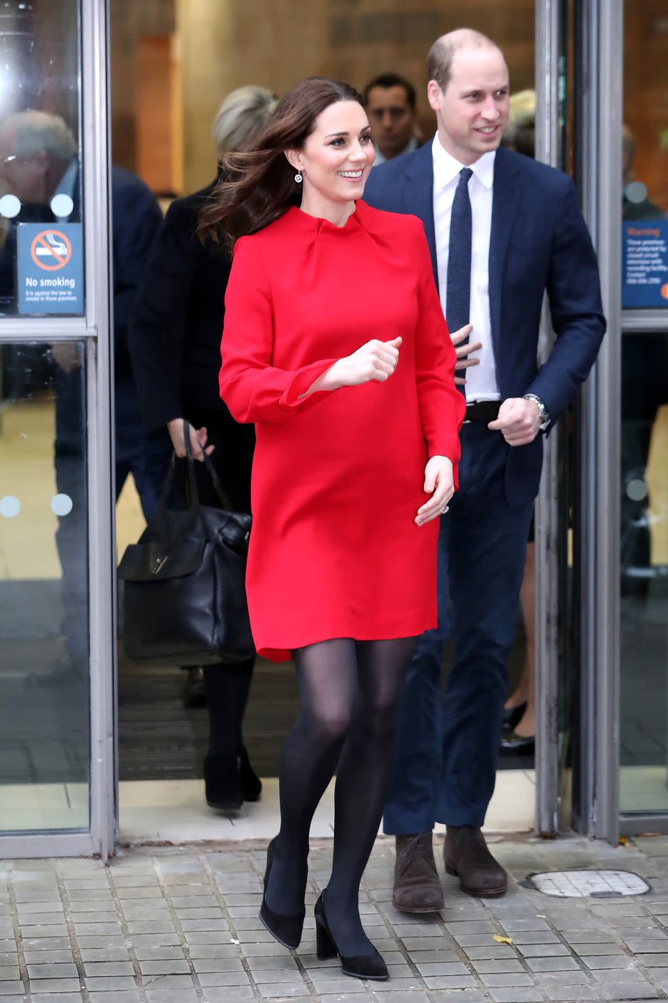 <p>The Duchess wears a red long-sleeved dress by Goat Fashion, black tights, and black pumps with Prince William at the Manchester Central Convention Complex.</p>