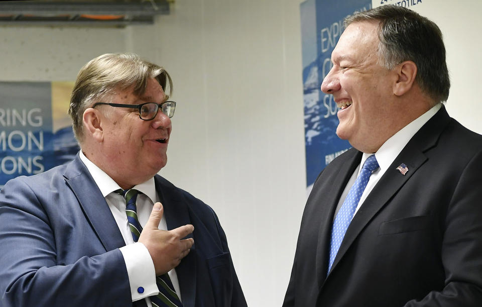 U.S. Secretary of State Mike Pompeo, right, chats with Finland's Foreign Minister Timo Soini ahead of a bilateral meeting at the Lappi Areena in Rovaniemi, Finland Tuesday, May 7, 2019. (Mandel Ngan/Pool Photo via AP)