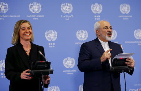 Iranian Foreign Minister Javad Zarif and the High Representative of the European Union for Foreign Affairs and Security Policy Federica Mogherini address a news conference at the United Nations building in Vienna, Austria, January 16, 2016. REUTERS/Leonhard Foeger