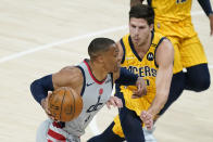 Washington Wizards' Russell Westbrook (4) goes to the basket against Indiana Pacers' Doug McDermott (20) during the first half of an NBA basketball game Saturday, May 8, 2021, in Indianapolis. (AP Photo/Darron Cummings)