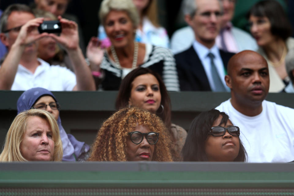 Oracene Price (C) and Charles Barkley (R) look on ahead of the Ladies’ Singles final match between Serena Williams of the USA and Agnieszka Radwanska of Polandon day twelve of the Wimbledon Lawn Tennis Championships at the All England Lawn Tennis and Croquet Club on July 7, 2012 in London, England. (Photo by Julian Finney/Getty Images)