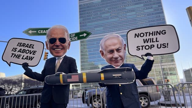 Cardboard cutouts by protesters show Israeli Prime Minister Benjamin Netanyahu riding a U.S. missile ahead of the Gaza cease-fire vote by the United Nations Security Council in New York City on Feb. 20.