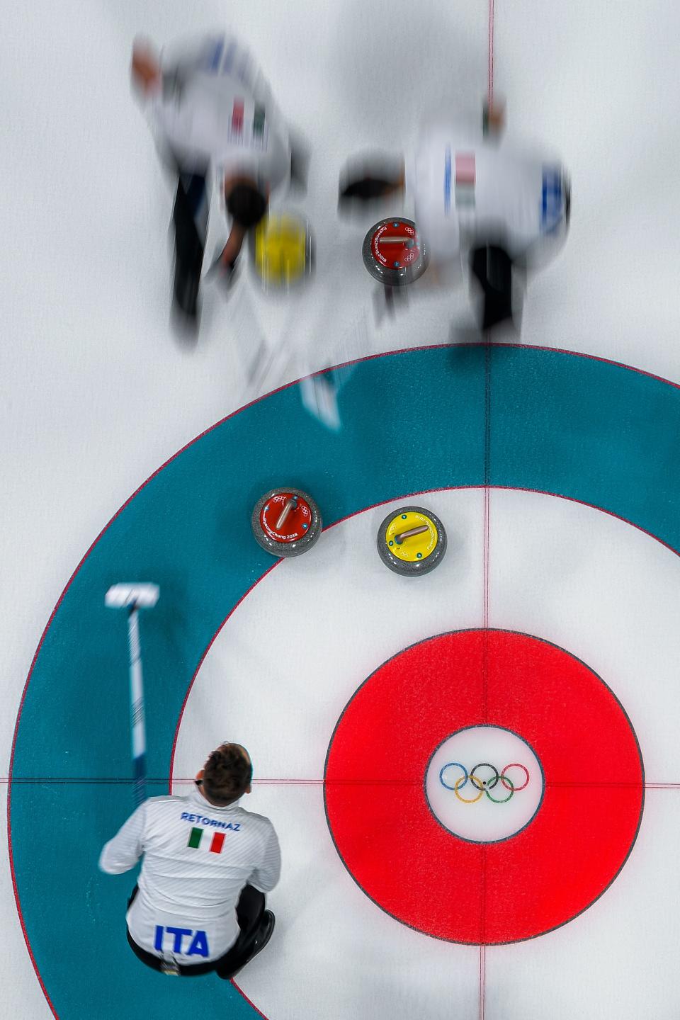 <p>Italian team competes during the curling men’s round robin session between Canada and Italy at the Pyeongchang 2018 Winter Olympic Games at the Gangneung Curling Centre in Gangneung on February 14, 2018. / AFP PHOTO / François-Xavier MARIT </p>