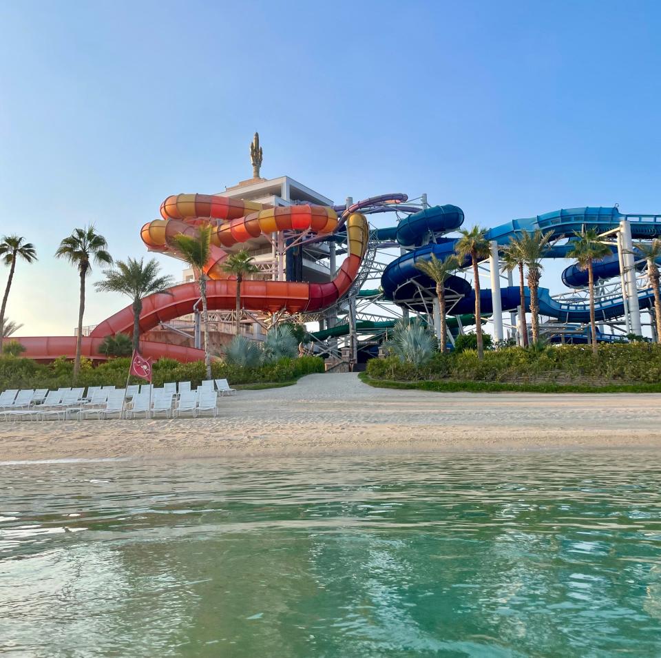 Two winding orange and blue water slides.