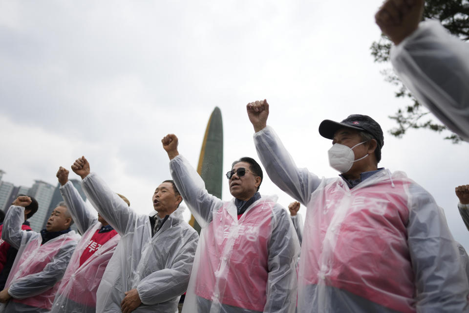 Members of the association of dog farmers, shout slogans during a rally in Seoul, South Korea, Tuesday, April 25, 2023. Dozens of dog farmers in South Korea rallied Tuesday to criticize the country’s first lady over her reported comments that support a possible ban on dog meat consumption. (AP Photo/Lee Jin-man)