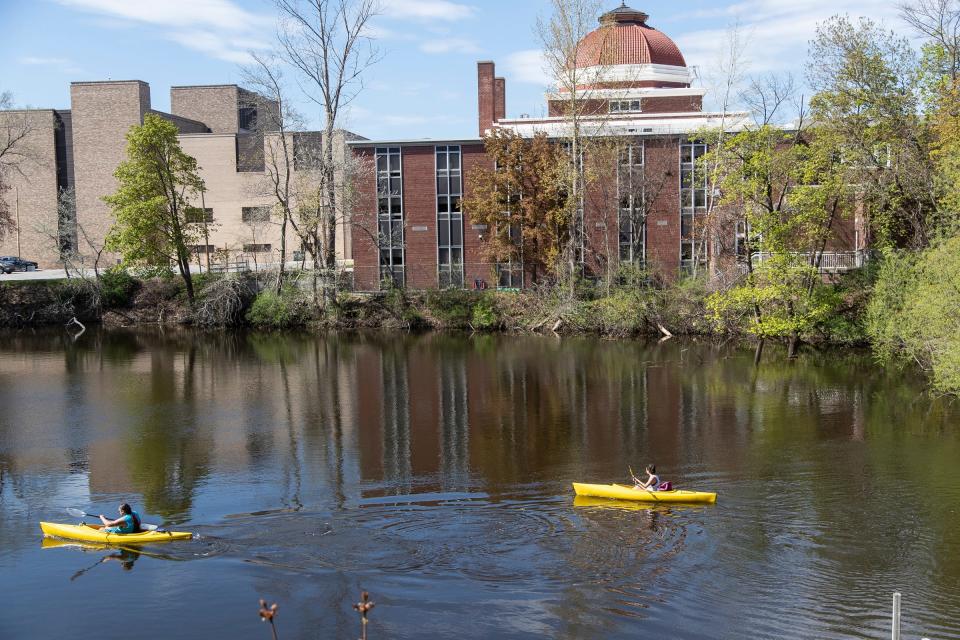 Kayakers on Boardman River in downtown Traverse City on May 22, 2020.