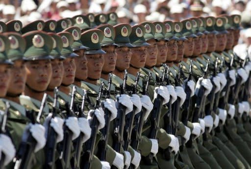 Chinese soldiers take part in a 2004 military parade to mark the establishment of a miltary barracks in Hong Kong. China has appointed military officers at a newly-established garrison in the South China Sea, the country's latest step to bolster claims to disputed islands in the area