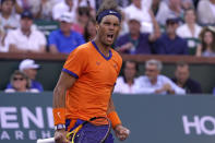 Rafael Nadal, of Spain, celebrates winning a point against Taylor Fritz during the men's singles finals at the BNP Paribas Open tennis tournament Sunday, March 20, 2022, in Indian Wells, Calif. (AP Photo/Mark J. Terrill)