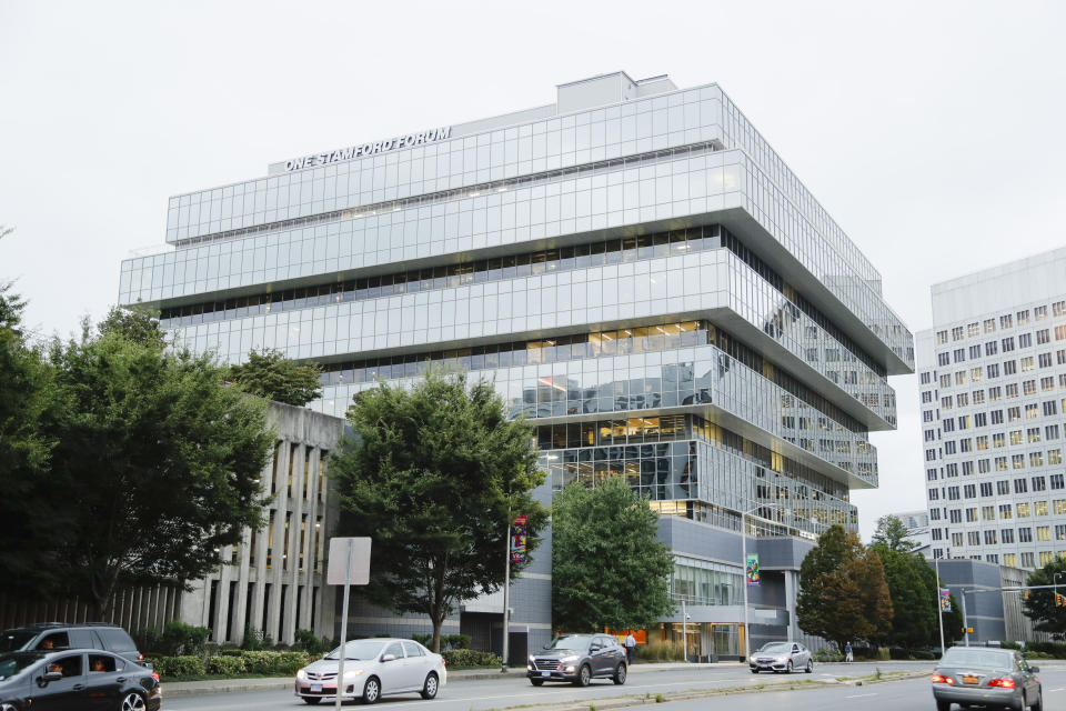 FILE - In this Thursday, Sept. 12, 2019 file photo, cars pass Purdue Pharma headquarters in Stamford, Conn. The allegations surrounding wealthy donors such as the Sackler family have raised questions for the museums they supported, including whether to keep the family's name on prominent galleries. The billionaire family is notorious for its ties to the drug company Purdue Pharma, which developed OxyContin, a painkiller that has been at the center of the opioid crisis. (AP Photo/Frank Franklin II, File)