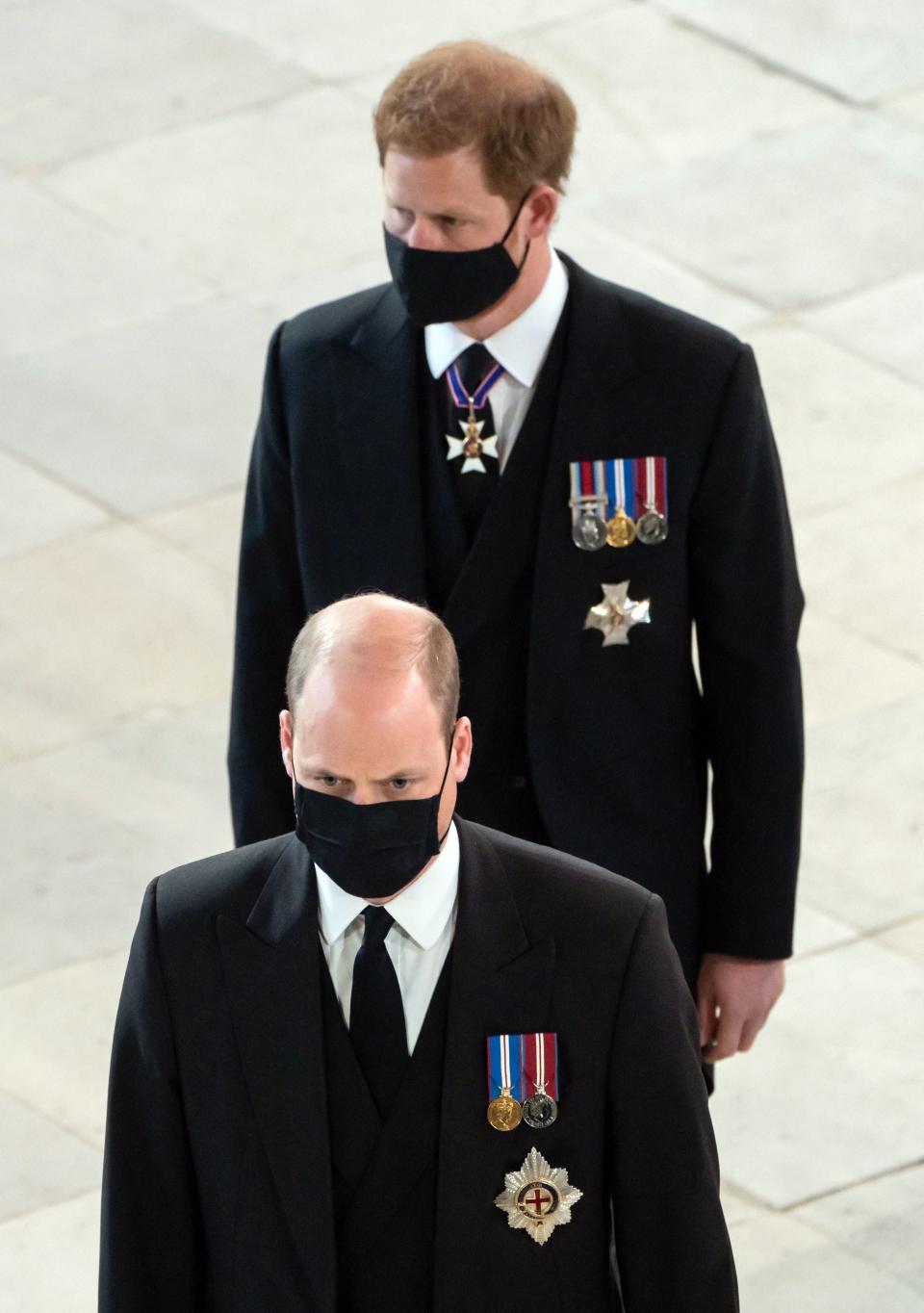 Britain's Prince William, Duke of Cambridge, (L) and Britain's Prince Harry, Duke of Sussex, arrive for the funeral service of
