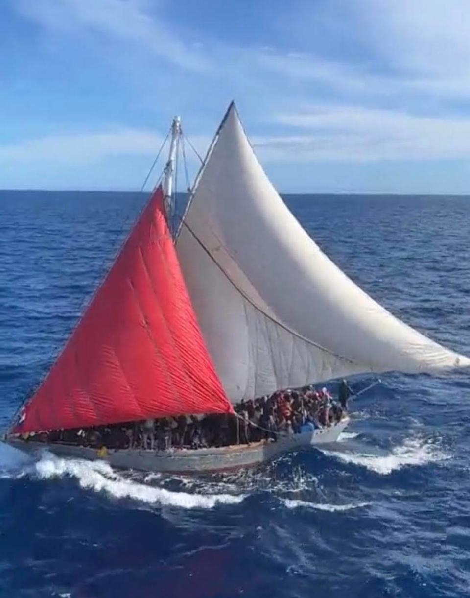 Close to 400 people crowd the deck of a Haitian migrant boat in the ocean near Cay Sal Bank in the Bahamas Sunday, Jan. 22, 2023.