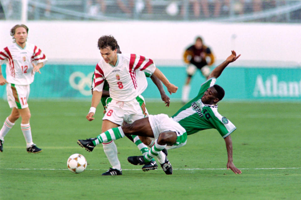 On July 21, 1996, Hungary's Tamas Sandorduring (C, 8) fights for the ball with Nigeria's Azuka Okocha (10) during the first half of their 1996 Summer Olympic match in Orlando.<span class="copyright">Pascal George—AFP via Getty Images</span>