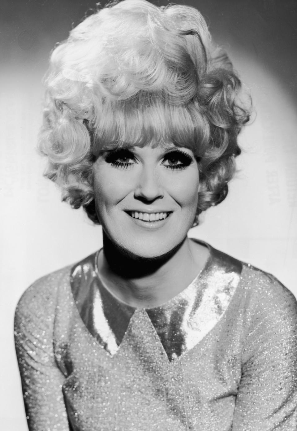 <p> Bouffant hairstyles were also commonly styled in piled-high curls back in the '60s, with the look often seen on music legend Dusty Springfield. Here, her look also features a classic block fringe and was probably set with a <em>lot</em> of hairspray. </p>