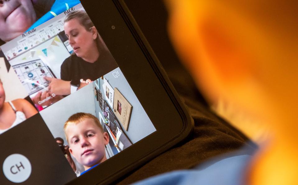 Nash Porter listens to Lakeview Elementary teacher Dana Oxender during the first day of virtual school Aug. 12, 2020.