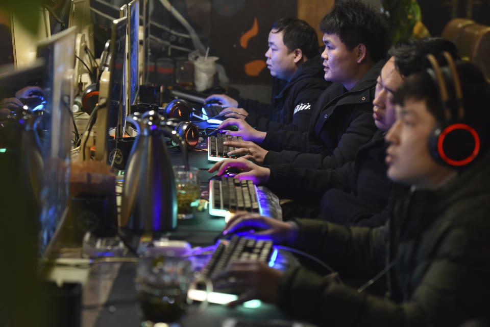 CORRECTS NUMBER OF GAMES TO 105- People play online games in an internet cafe in Fuyang in central China's Anhui province Friday, March 1, 2019. China's authority in charge of press and publications has approved 105 online games, saying it fully supports the industry after newly proposed curbs caused massive losses for major game companies. The National Press and Publication Administration issued a statement on its Weibo social media account Monday, Dec. 25, 2023, saying the approvals demonstrate active support for the development of online games.(Chinatopix via AP)