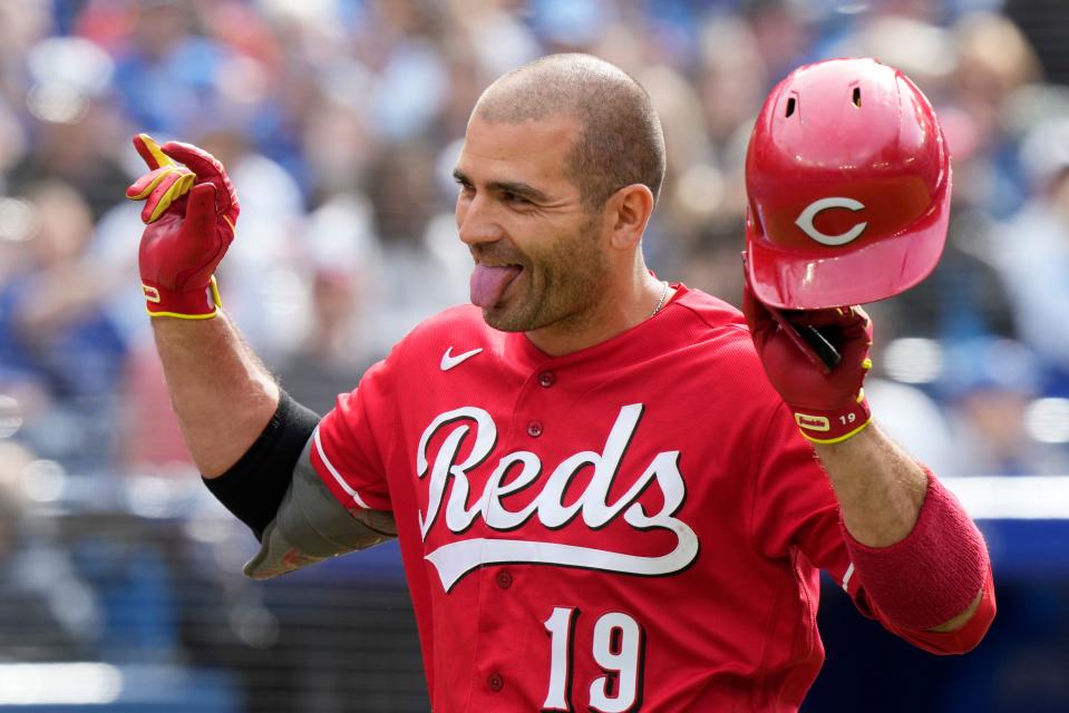Cincinnati Reds' Joey Votto celebrates his solo home run against the Toronto Blue Jays during eighth-inning baseball game action in Toronto, Sunday, May 22, 2022. (Frank Gunn/The Canadian Press via AP)